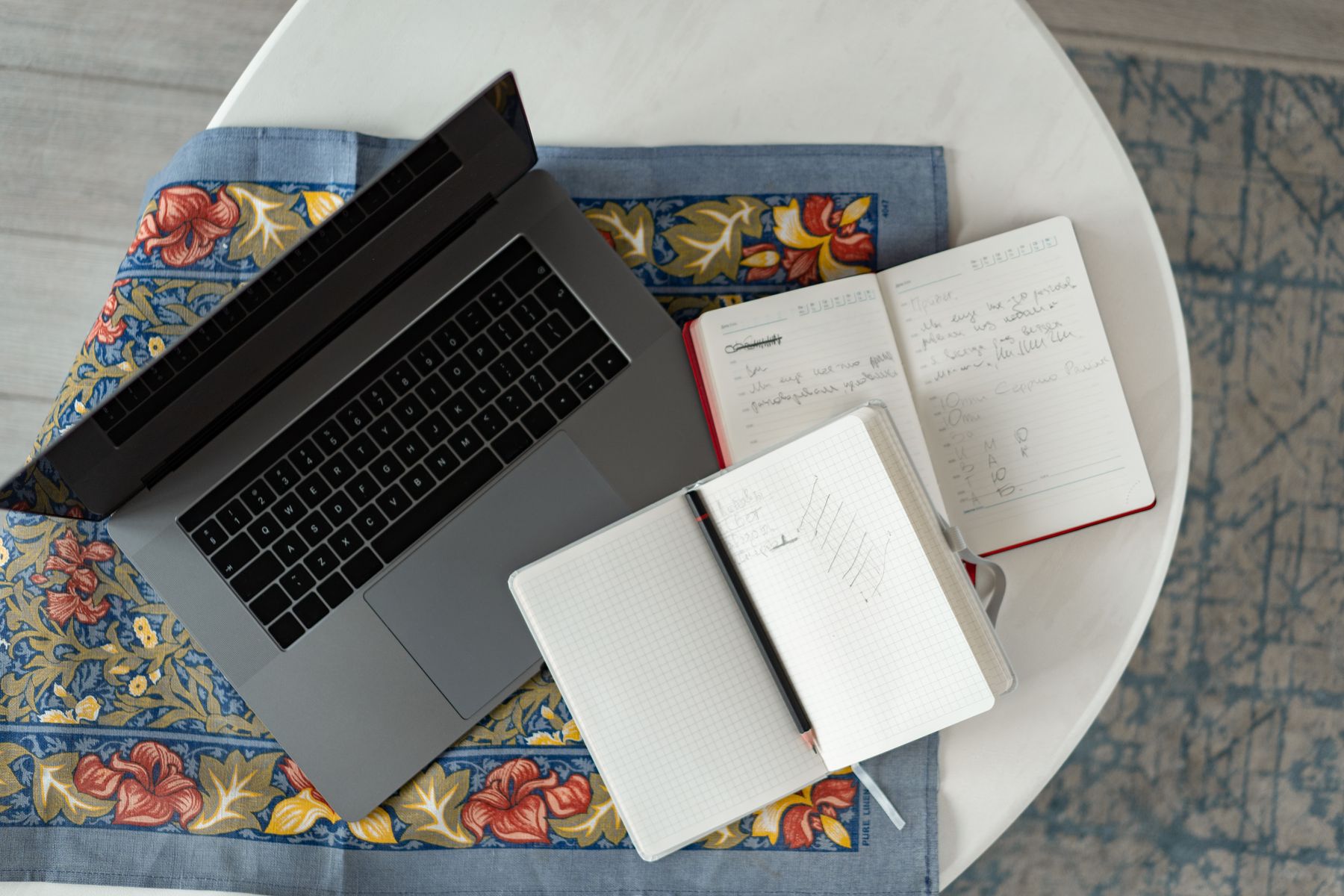 A laptop and notebook for essay writing