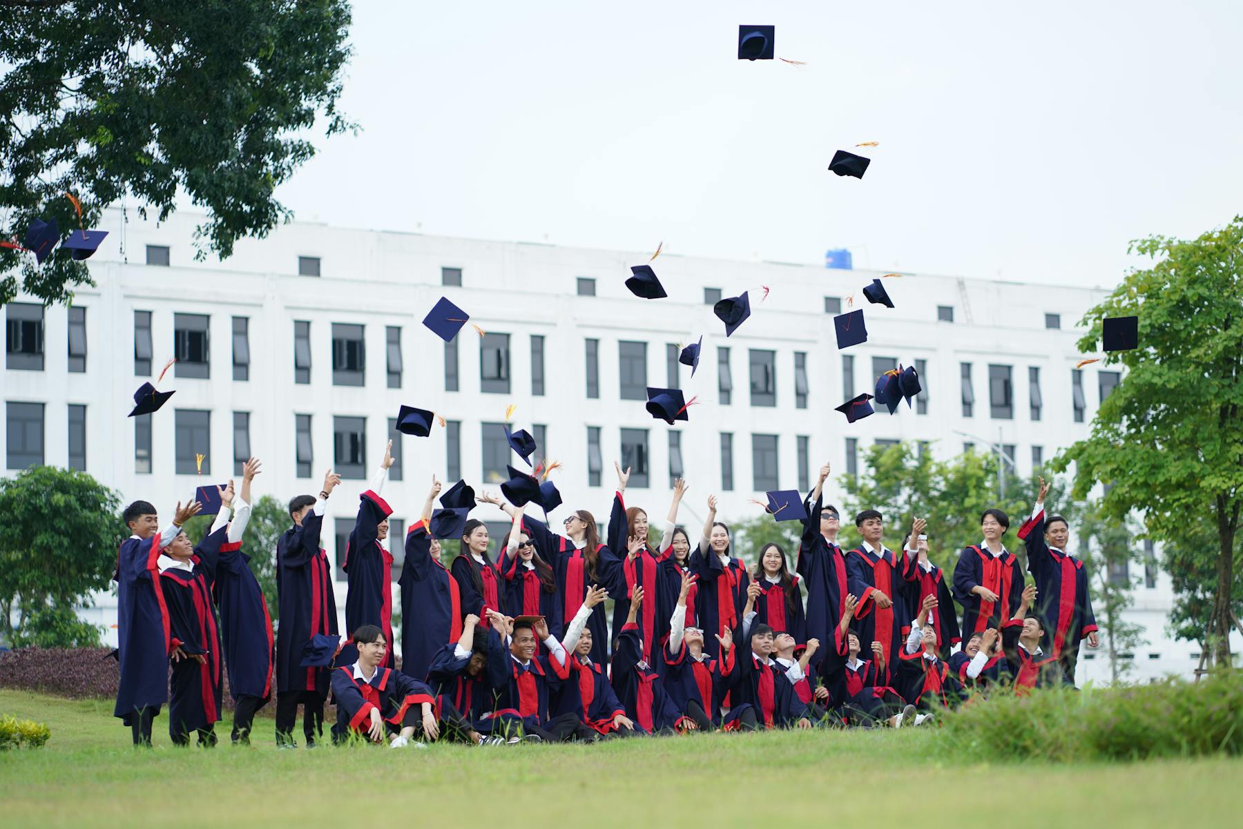 A graduate celebrating at commencement
